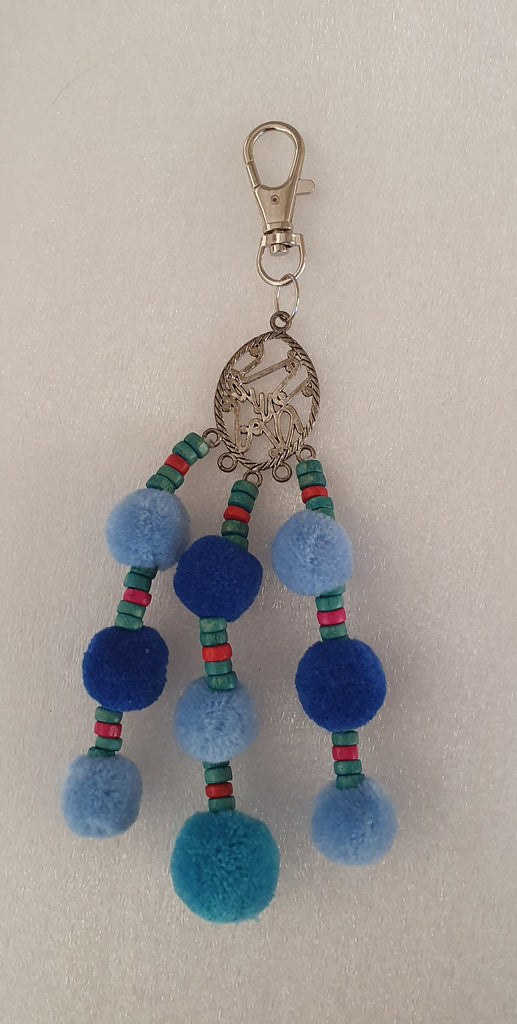 keyring/bag clip or charm blue pompom approx 16 cm long.