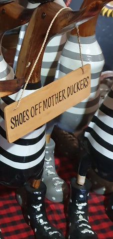 Duck sign... "shoes off Mother Duckers"